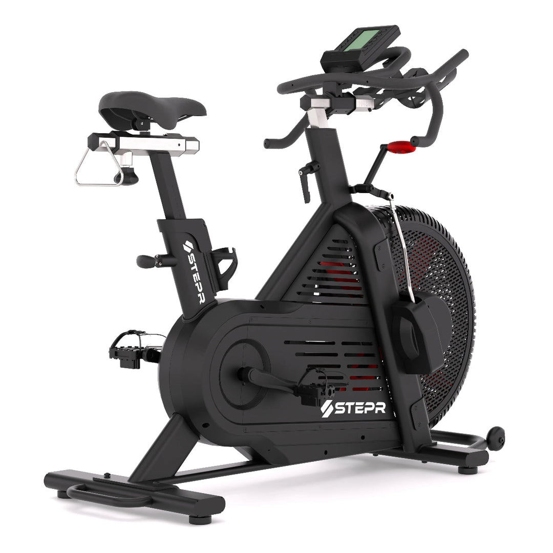 Black exercise bike with digital display on a white background
