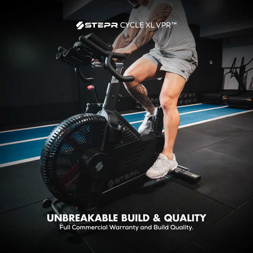 Person using a Stepra Cycle XL VPR exercise bike in a gym setting.